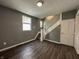 Open living room with hardwood floors and a staircase at 1016 W 31St St, Indianapolis, IN 46208