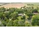 Aerial view of an estate with a pond and surrounding farmland at 10198 N State Road 75, North Salem, IN 46165