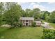 Stunning aerial view of a red brick home with a well-manicured lawn and landscaping at 10198 N State Road 75, North Salem, IN 46165