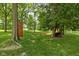 Secluded backyard featuring mature trees, a hammock, and wooded areas for relaxation at 10198 N State Road 75, North Salem, IN 46165
