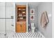 Stylish bathroom featuring a built-in wooden cabinet, hexagon tile flooring, and a glass-enclosed shower at 10198 N State Road 75, North Salem, IN 46165