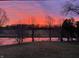 Scenic view of a pond with a beautiful sunset reflected in the water at 10198 N State Road 75, North Salem, IN 46165