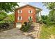 Red brick home with a garage and a stone path leading to the front entrance at 10198 N State Road 75, North Salem, IN 46165
