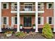 Welcoming front porch with white columns, decorative plants, and a stylish entryway at 10198 N State Road 75, North Salem, IN 46165