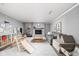 Spacious Gathering room with brick fireplace, play area, comfortable seating, and neutral decor at 10198 N State Road 75, North Salem, IN 46165