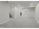 Open-concept basement featuring new carpeting, recessed lighting, and doorway at 10434 N Delaware St, Carmel, IN 46280