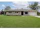 Charming stone-clad home with a well-maintained lawn and attached garage at 10434 N Delaware St, Carmel, IN 46280