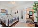 Cozy bedroom with natural light, decorative shelves, and view into an adjacent space at 1051 Elm St, Indianapolis, IN 46203