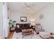 Bright living room showcasing a brown sofa, area rug, and neutral paint scheme at 1051 Elm St, Indianapolis, IN 46203