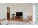 Bright living room featuring hardwood floors, neutral colors, and modern decor at 1051 Elm St, Indianapolis, IN 46203