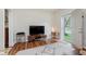 Bright living room featuring hardwood floors, neutral colors, and modern decor at 1051 Elm St, Indianapolis, IN 46203