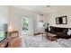 Comfortable living room with hardwood floors, neutral colors, and plenty of natural light at 1051 Elm St, Indianapolis, IN 46203