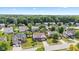 Expansive aerial view of a residential neighborhood with mature trees and well-maintained homes on a sunny day at 10611 Armstead Ave, Indianapolis, IN 46234