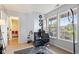 Bright bedroom with natural light, modern black chair, and neutral carpet at 10611 Armstead Ave, Indianapolis, IN 46234