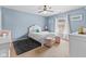 Charming bedroom with great natural light, features a ceiling fan and carpet floors at 10611 Armstead Ave, Indianapolis, IN 46234