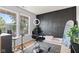 Bright bedroom with two windows, a black accent wall, and contemporary decor at 10611 Armstead Ave, Indianapolis, IN 46234