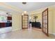 Dining room with tile floors, pendant lighting, and open access to the kitchen at 10611 Armstead Ave, Indianapolis, IN 46234