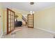 Bright dining room with pendant lighting, tile floors, and french doors opening to another room at 10611 Armstead Ave, Indianapolis, IN 46234