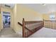 Upstairs hallway with railing that overlooks a large bedroom at 10611 Armstead Ave, Indianapolis, IN 46234