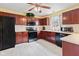 Well-equipped kitchen featuring stainless steel appliances, custom cabinets and bright countertops at 10611 Armstead Ave, Indianapolis, IN 46234
