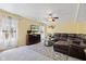 Cozy living room with plush seating, a decorative fireplace, and ample natural light at 10611 Armstead Ave, Indianapolis, IN 46234