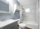 Nicely renovated bathroom featuring modern fixtures, stylish vanity, a showerhead, and a bathtub at 1217 S Ewing St, Indianapolis, IN 46203