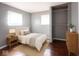 Comfortable bedroom with natural light, closet space, and neutral decor at 1217 S Ewing St, Indianapolis, IN 46203