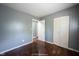 Cozy bedroom with wood floors, ample closet space, and neutral colored walls creating a calm space at 1217 S Ewing St, Indianapolis, IN 46203