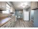 Functional kitchen with essential appliances, spacious countertops, and ample cabinet storage at 1217 S Ewing St, Indianapolis, IN 46203