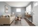 Comfortable living room with stylish decor, hard wood floors, and a bright, airy feel at 1217 S Ewing St, Indianapolis, IN 46203