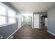 This light-filled living room features hard wood flooring and modern neutral paint at 1217 S Ewing St, Indianapolis, IN 46203