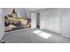 Bright bedroom featuring an imaginative mural and a double sliding-door closet at 1231 N Graham Ave, Indianapolis, IN 46219