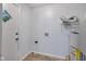 Laundry room with water heater, access door, and utility connections at 1231 N Graham Ave, Indianapolis, IN 46219