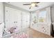 Cozy bedroom with a crib, natural light, closet, and dresser, perfect for creating a warm and inviting space at 12404 Guy Way, Indianapolis, IN 46236