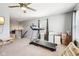 Spacious bonus room with carpet, a treadmill, natural light, and versatile space for recreation and fitness at 12404 Guy Way, Indianapolis, IN 46236