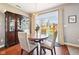 Cozy dining area with a round table, chandelier, and a view of the backyard at 12404 Guy Way, Indianapolis, IN 46236