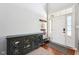 Bright foyer featuring a high ceiling, wood floors, and stylish cabinet at 12404 Guy Way, Indianapolis, IN 46236