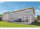 Exterior view of home showing backyard, patio and sliding doors at 12404 Guy Way, Indianapolis, IN 46236