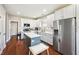 Modern kitchen featuring white cabinets, stainless steel appliances, and a butcher-block island at 12404 Guy Way, Indianapolis, IN 46236