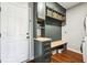 Hallway showing mudroom, storage, bench and hardwood floors at 12404 Guy Way, Indianapolis, IN 46236