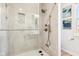 Modern shower with glass door, rainfall shower head, and built-in shelving for a spa-like experience at 12404 Guy Way, Indianapolis, IN 46236