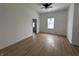 Bright bedroom featuring fresh paint, modern flooring and a large window at 1256 Kappes St, Indianapolis, IN 46221
