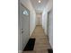 Bright hallway featuring wood-look flooring, fresh white walls, and recessed lighting at 1256 Kappes St, Indianapolis, IN 46221