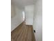 Bright hallway featuring wood-look flooring and fresh white walls at 1256 Kappes St, Indianapolis, IN 46221