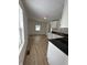Kitchen featuring white cabinets, black countertops, and modern flooring at 1256 Kappes St, Indianapolis, IN 46221