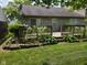 Cozy back deck with wooden railing and steps leading to a green lawn, perfect for outdoor relaxation and entertaining at 1311 Flintlock Dr, Greenwood, IN 46143