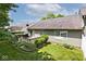 Exterior shot of a home featuring a wooden deck and well-maintained yard with lush greenery at 1311 Flintlock Dr, Greenwood, IN 46143