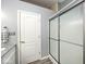 Bathroom features a glass enclosed shower with gray tile and a modern white vanity with granite countertops at 1311 Flintlock Dr, Greenwood, IN 46143