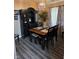 Dining room with classic table, chairs, floors, decor, curtains, and lighting at 1311 Flintlock Dr, Greenwood, IN 46143