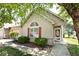 Charming single-story home featuring light siding, red shutters, and a well-manicured front yard at 1311 Flintlock Dr, Greenwood, IN 46143